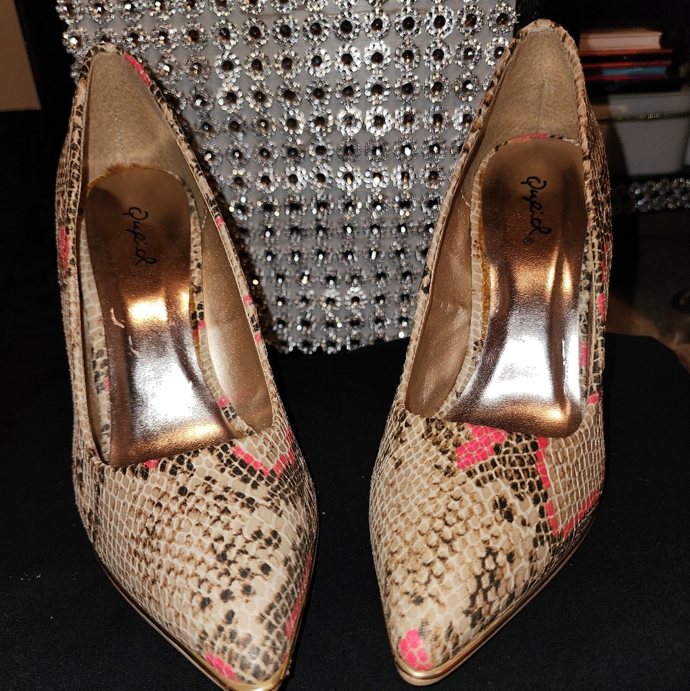 Tan, pink, and brown snake skin pumps